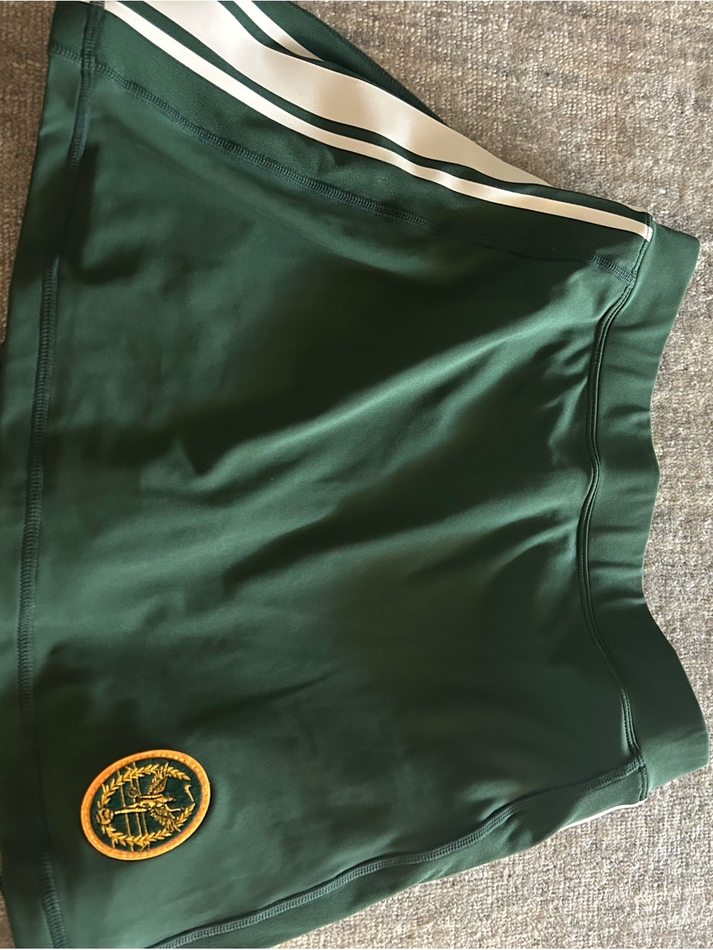 Nike Forest Green Athletic Skirt with White Stripes and Gold Crest